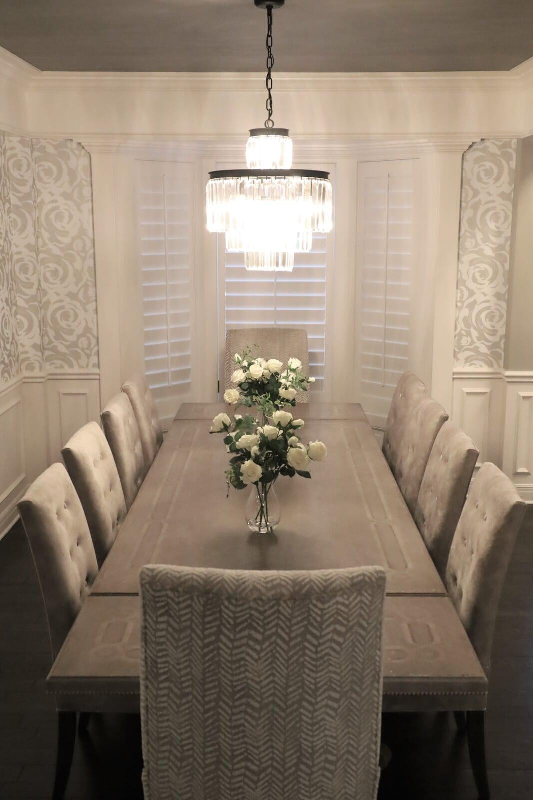 Wallpaper, linear crystal chandelier, plantation shutters, Arhaus Table, Custom chair, silver wallpaper